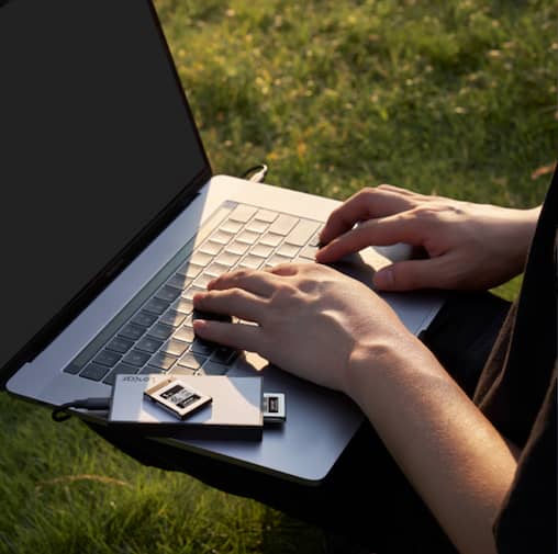 An editor using a Lexar Professional Card Reader.