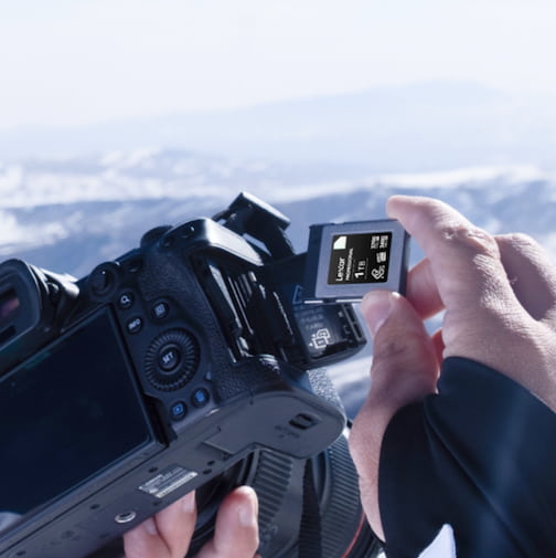 A professional photographer using Lexar 1TB Professional SD Card.